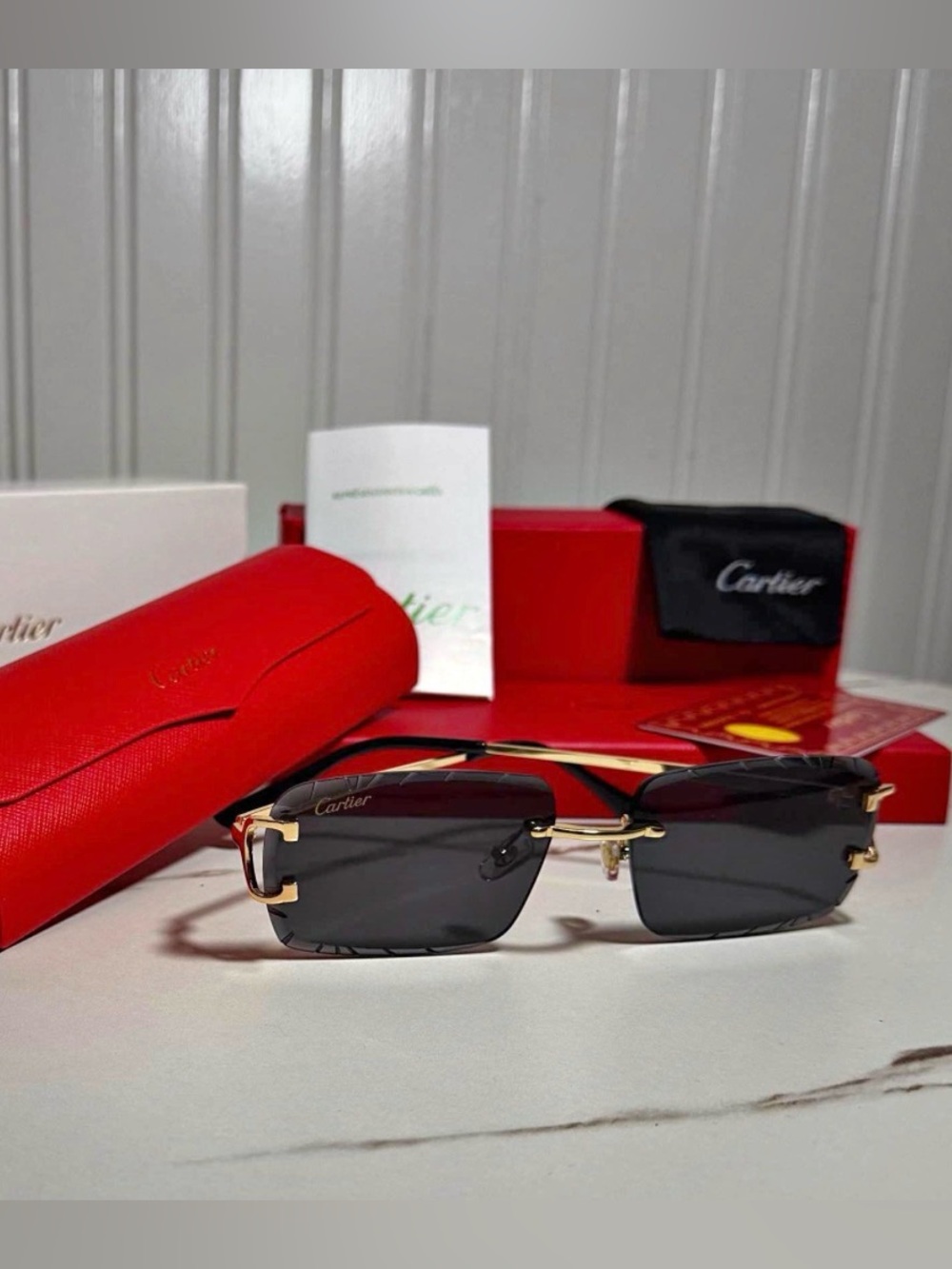Cartier Men's Sunglasses in Black and Gold with Red Case